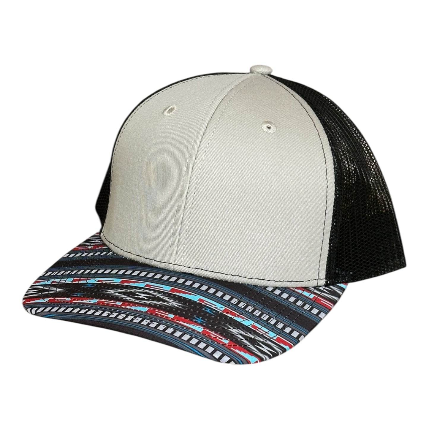 Tri-color trucker hat with gray cap a black mesh back and a colorful southwest patterned brim on a white background
