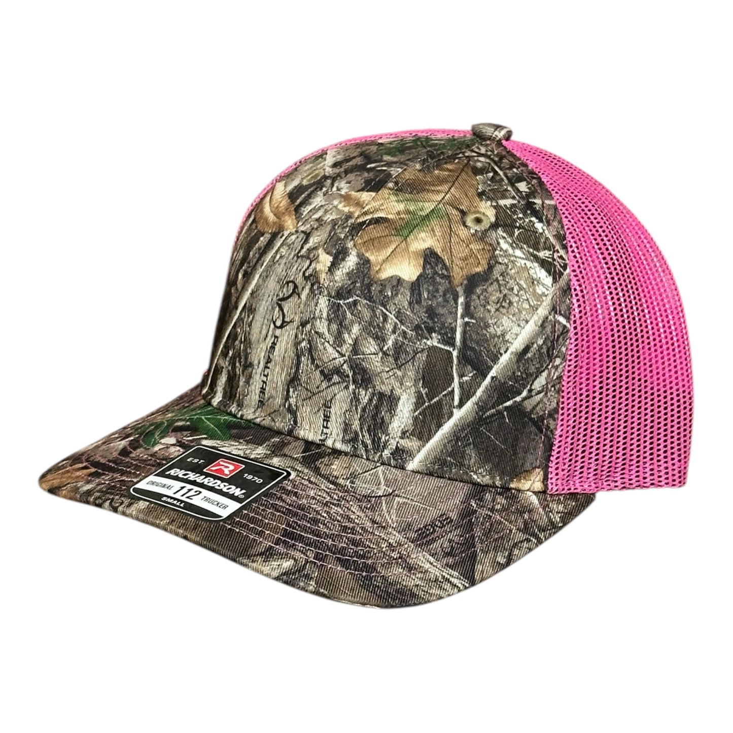 Camouflage trucker cap with pink mesh back and a visible brand logo label on a white background