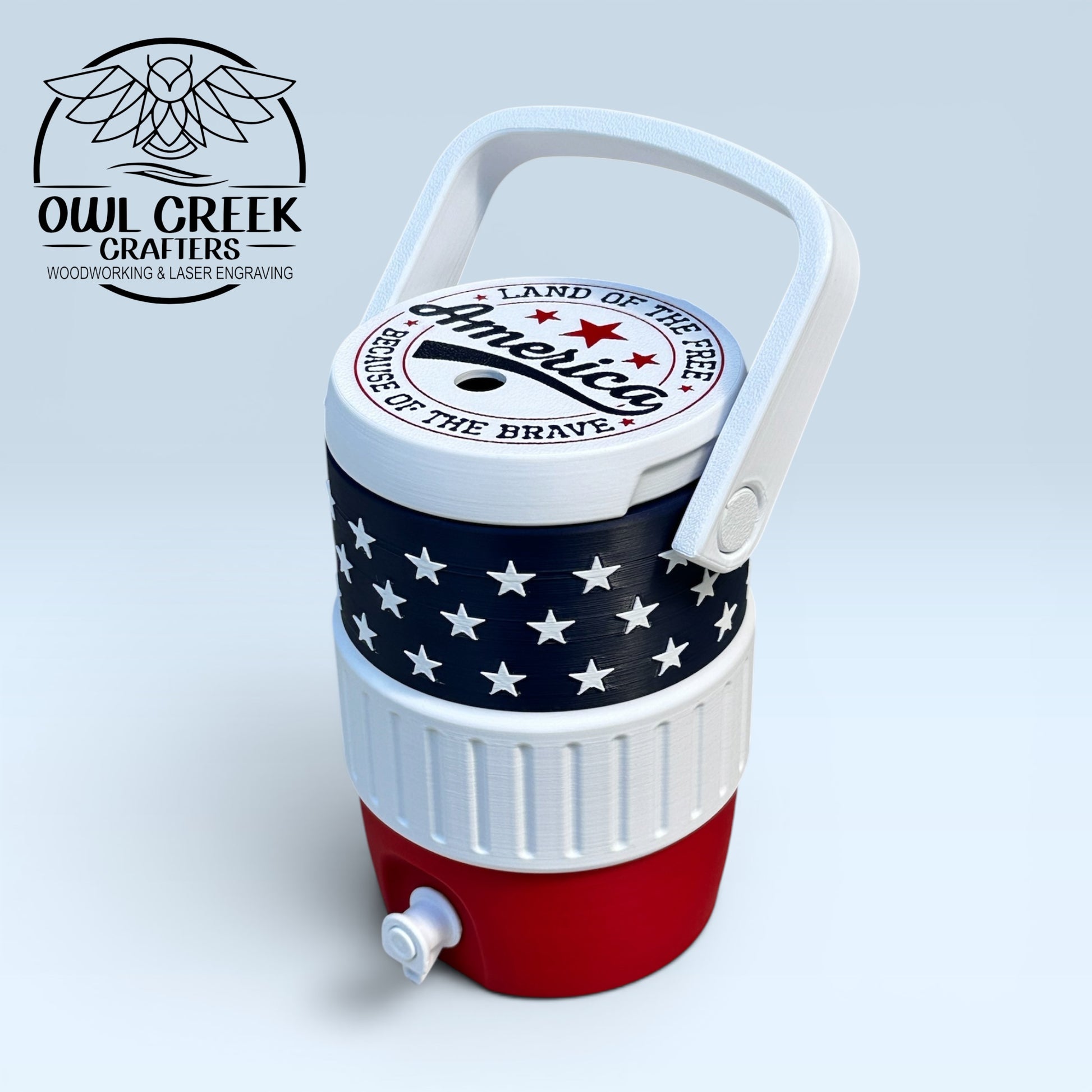 American flag-themed can cooler coozie on a light gray background with the Owl Creek Crafters logo