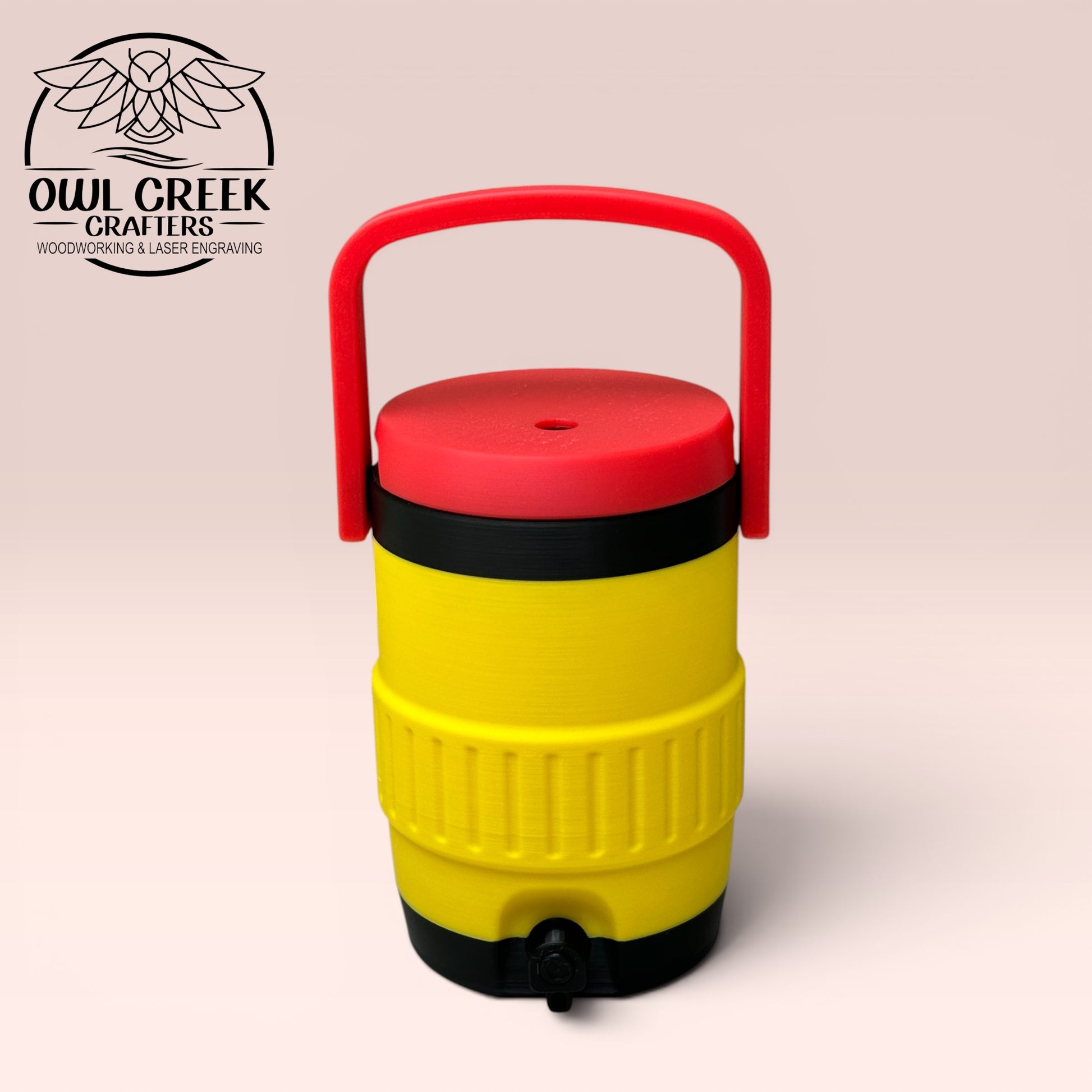 Yellow and black can cooler coozie with a red lid and handle, on a beige background with the Owl Creek Crafters Logo