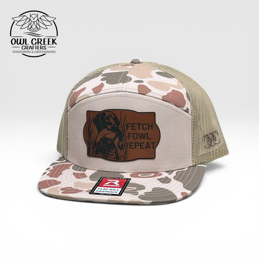 Beige and green camouflage-patterned cap with leatherette patch and the Owl Creek Crafters brand logo on a white background