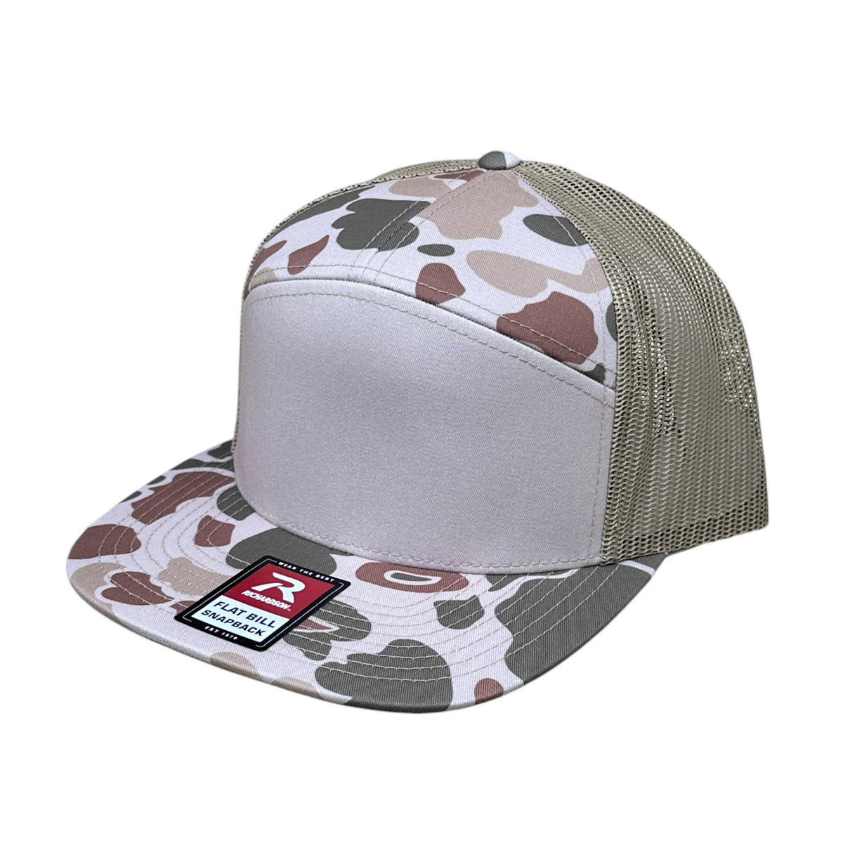 A trucker-style snapback cap with a light gray front panel and camouflage pattern on the front panels and brim, paired with a taupe mesh back. A red and black 'Richardson' brand patch is visible on the brim. On a white background