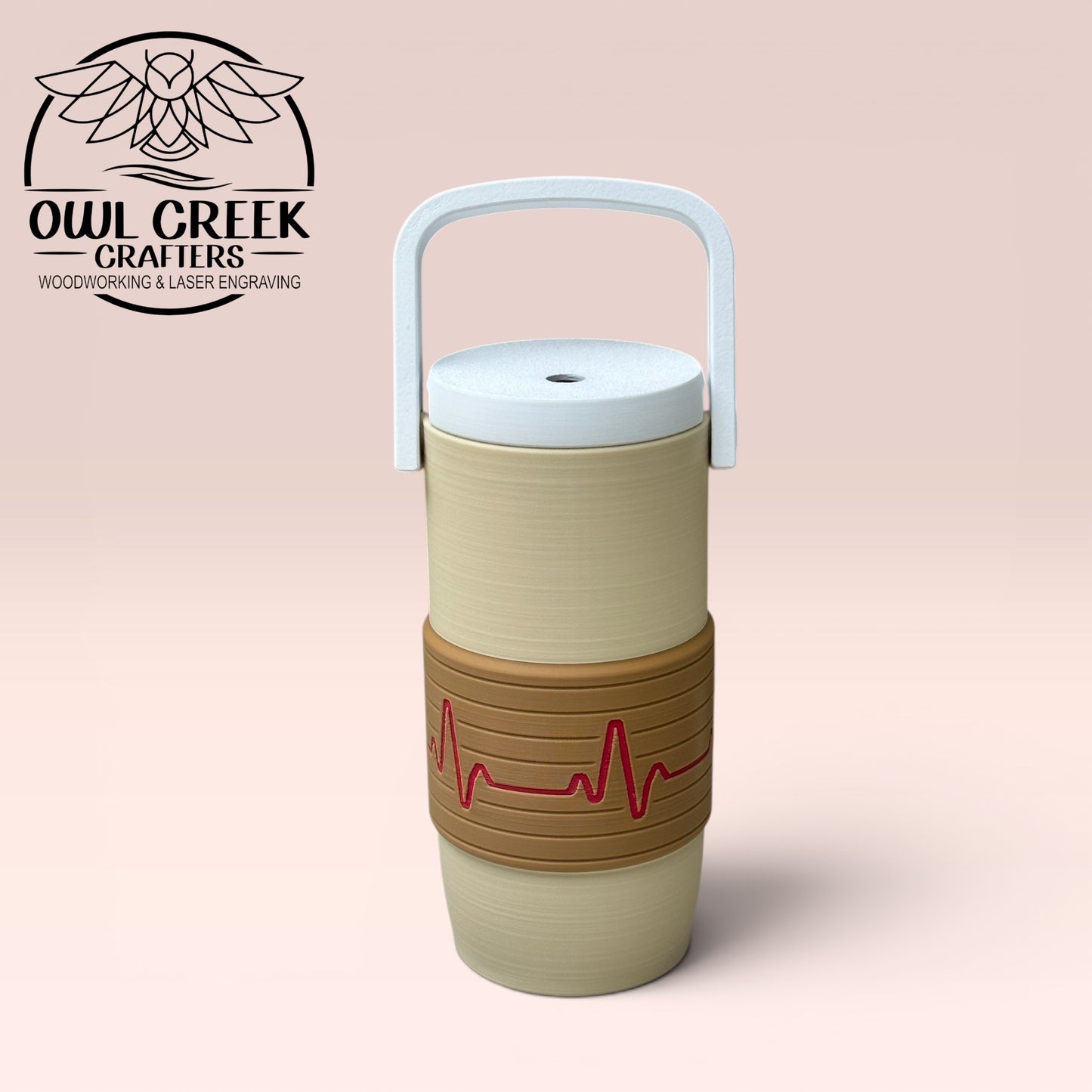Beige and brown can cooler coozie with a magenta EKG design, and a white handle and lid on a beige background, featuring the Owl Greek Crafters logo.