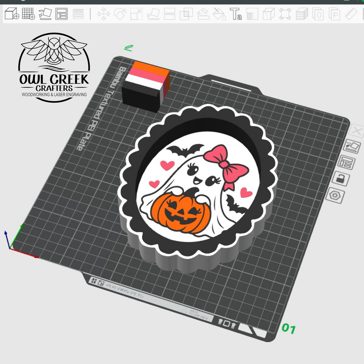 A 3D rendering of a scalloped oval trinket tray shown on a gray gridded crafting mat. The tray features a Halloween ghost design with a pink bow, black bat silhouettes, and a carved orange pumpkin on a white background. The Owl Creek Crafters logo is in the left corner.